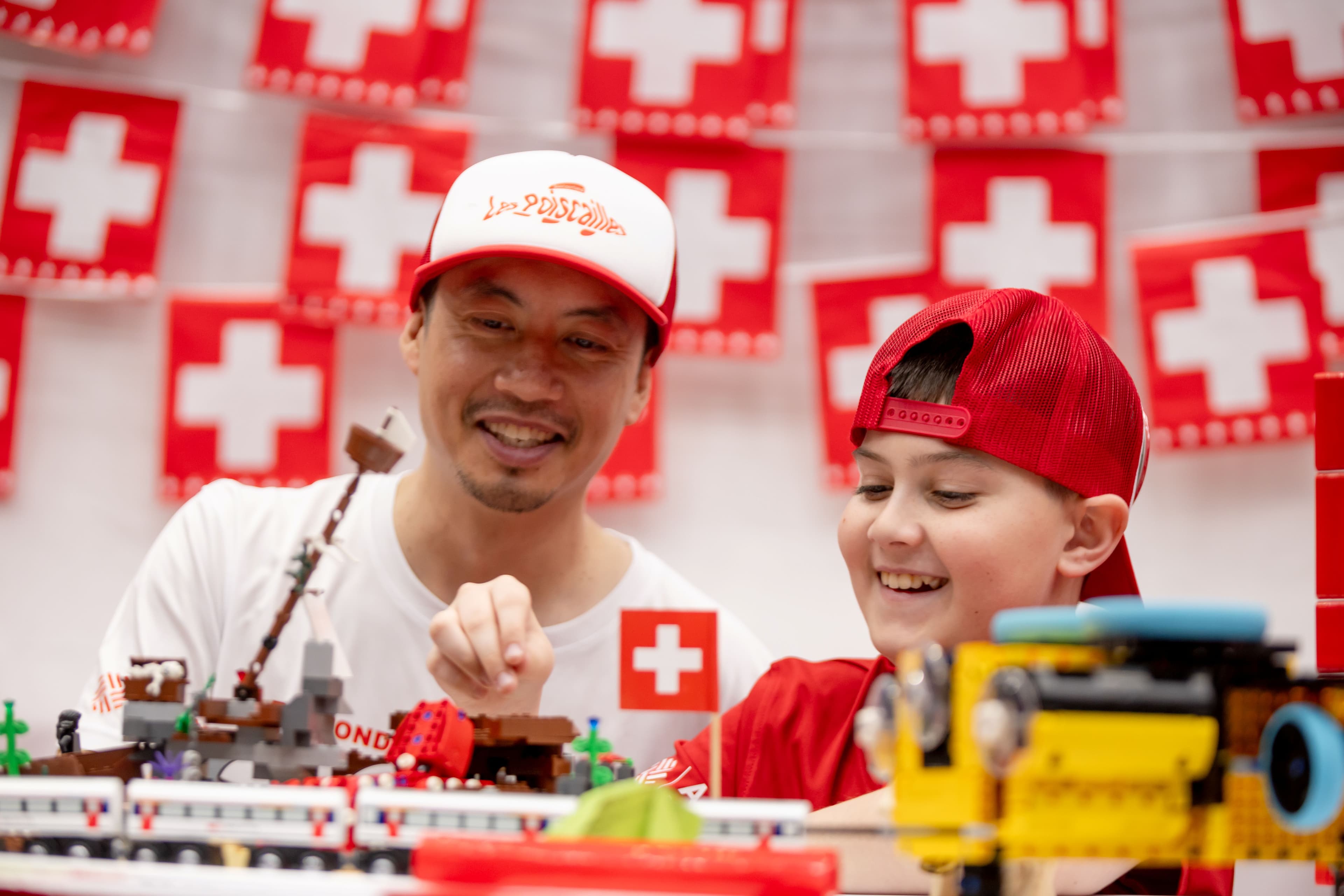 FIRST LEGO League student and mentor smiling as they talk about the seasons challenge.